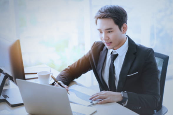 About Us Man with a laptop